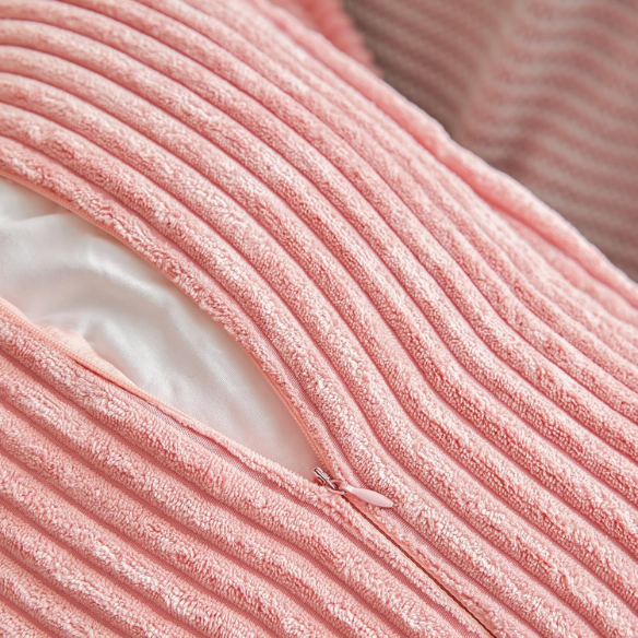 Pink corduroy pillow cover with modern geometric striped pattern, eco-friendly, machine washable, suitable for sofas, bedrooms, offices, and outdoor patios.