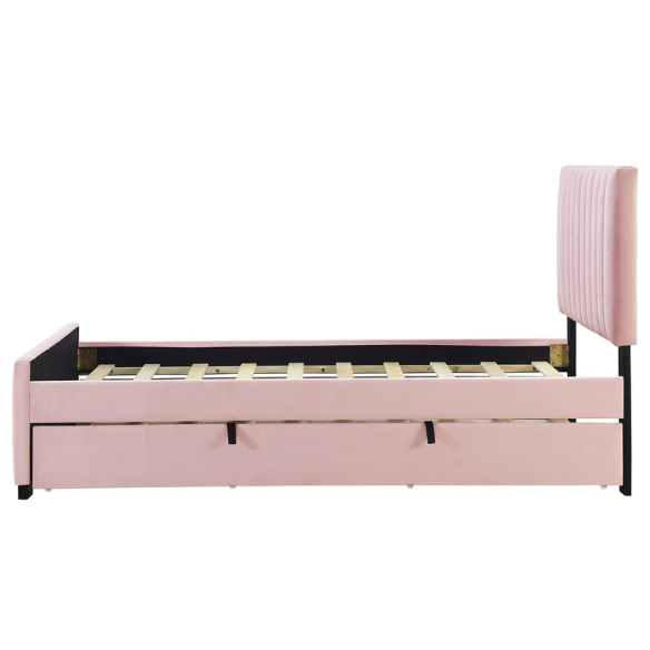 Pink twin upholstered platform bed with tufted velvet headboard and pull-out trundle, designed for kids, teens, or guest rooms, featuring a soft pink finish and space-saving design.