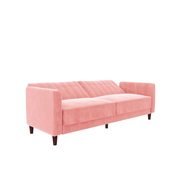 Pink velvet convertible sofa with tufted split-back design, square arms, and tapered brown wood legs, easily converting into a twin-size sleeper.