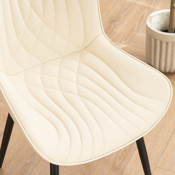 Set of 2 beige faux leather dining chairs with modern fishtail backrest and black metal legs, designed for contemporary dining spaces.