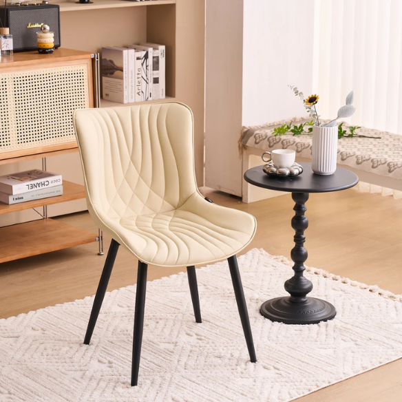 Set of 2 beige faux leather dining chairs with modern fishtail backrest and black metal legs, designed for contemporary dining spaces.