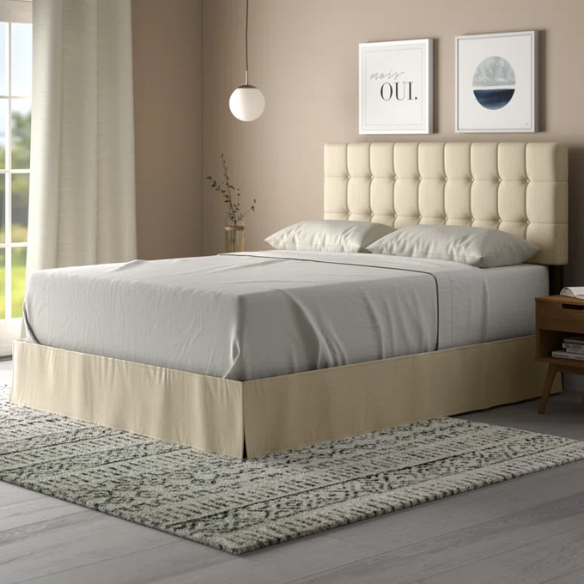 Beige queen bed with tufted wingback headboard, upholstered in soft polyester fabric with nailhead trim.