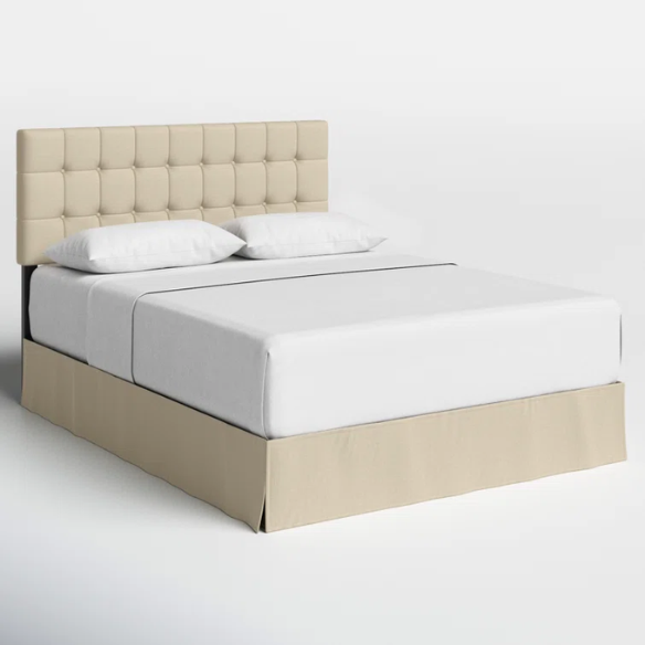 Beige queen bed with tufted wingback headboard, upholstered in soft polyester fabric with nailhead trim.