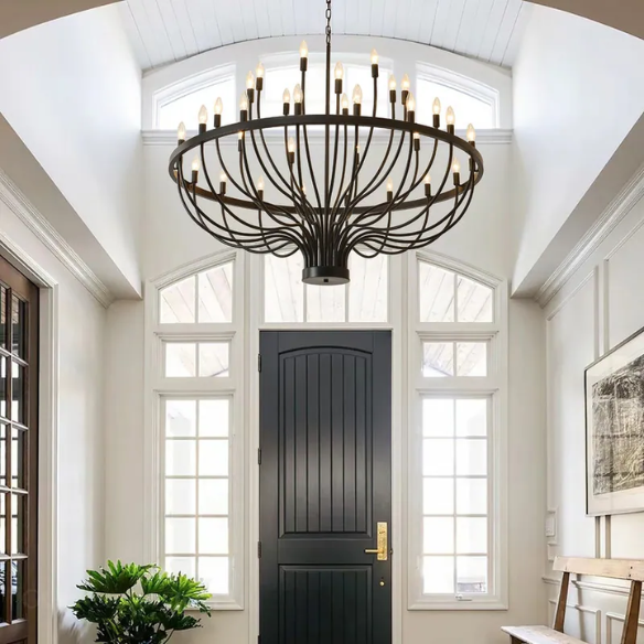 Oversized black farmhouse chandelier with 33 candle-style lights on a wagon wheel frame, ideal for high ceilings, dining rooms, and entryways