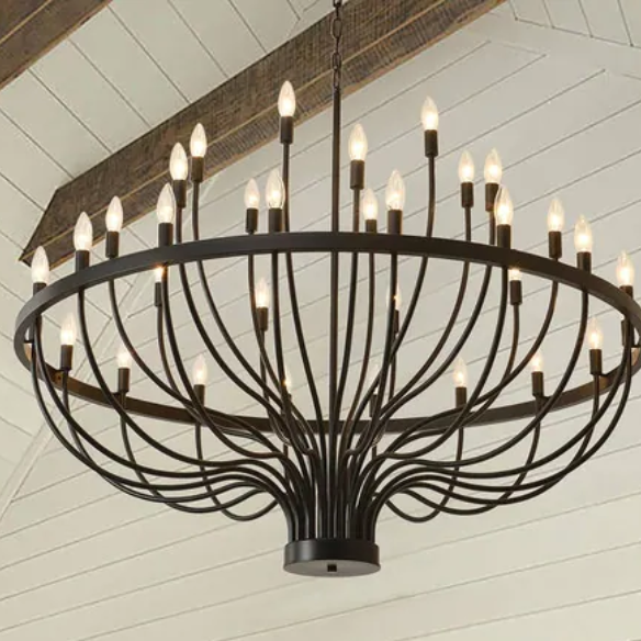 Oversized black farmhouse chandelier with 33 candle-style lights on a wagon wheel frame, ideal for high ceilings, dining rooms, and entryways