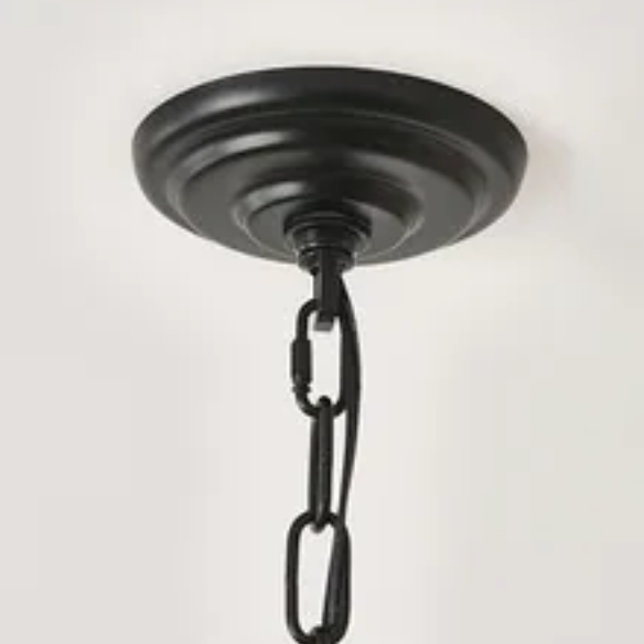Oversized black farmhouse chandelier with 33 candle-style lights on a wagon wheel frame, ideal for high ceilings, dining rooms, and entryways