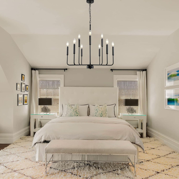 Black 9-light industrial chandelier with candle-style arms and adjustable hanging height, ideal for dining rooms, kitchens, or vaulted ceilings