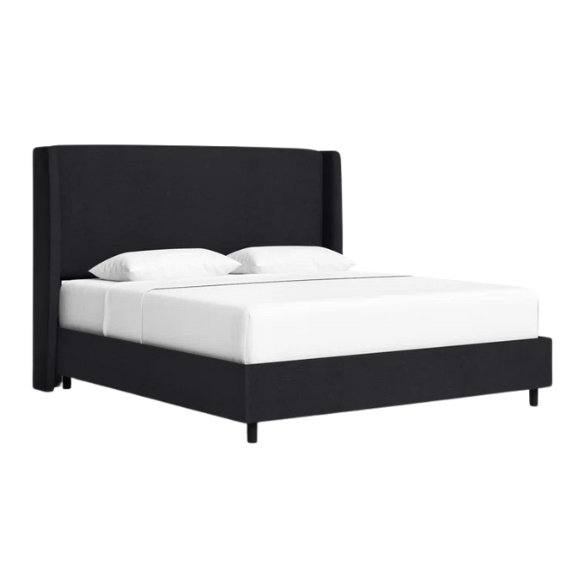 Black king-size upholstered bed in linen fabric with wingback headboard and low-profile black metal legs.