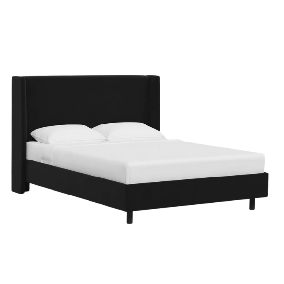 Black king-size upholstered bed in twill fabric with wingback headboard and low-profile black metal legs.
