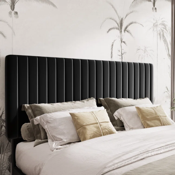 Black velvet upholstered queen bed with tufted wingback headboard and low-profile frame.