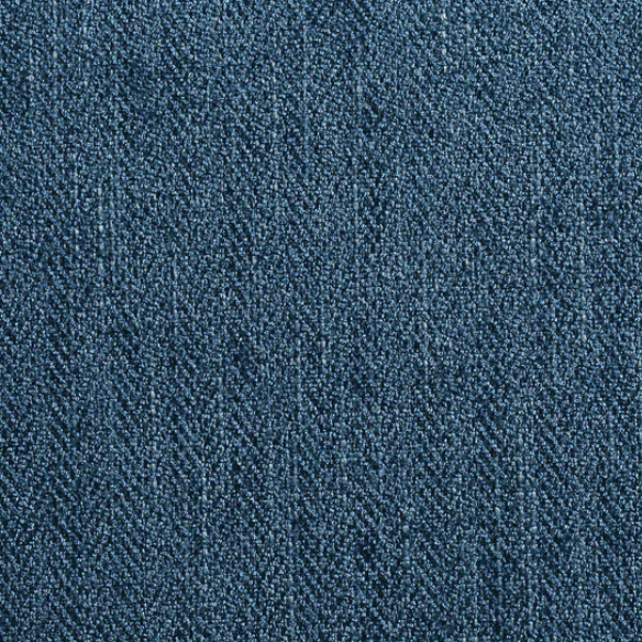 Blue denim upholstered Parsons chair with scrolled back, antique bronze nailhead trim, and solid wood legs
