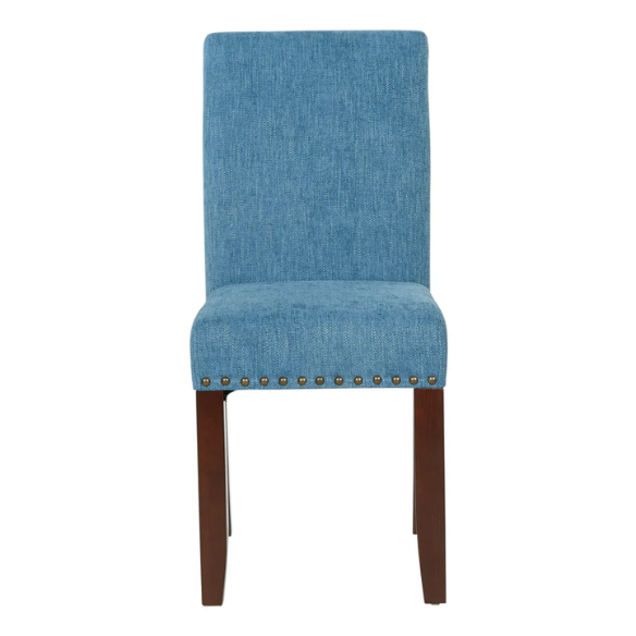 Blue denim upholstered Parsons chair with scrolled back, antique bronze nailhead trim, and solid wood legs
