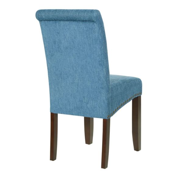 Blue denim upholstered Parsons chair with scrolled back, antique bronze nailhead trim, and solid wood legs
