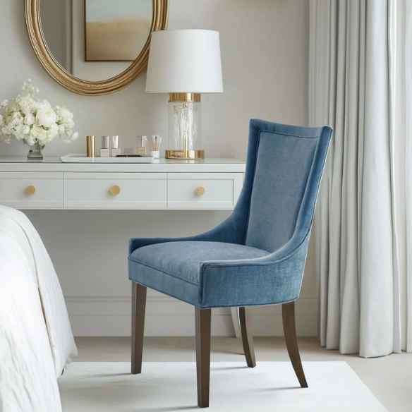 Set of 2 upholstered armless dining chairs in rich blue chenille with solid wood legs, high backs, and piped detailing.