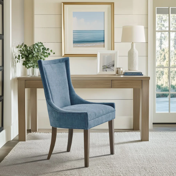 Set of 2 upholstered armless dining chairs in rich blue chenille with solid wood legs, high backs, and piped detailing.