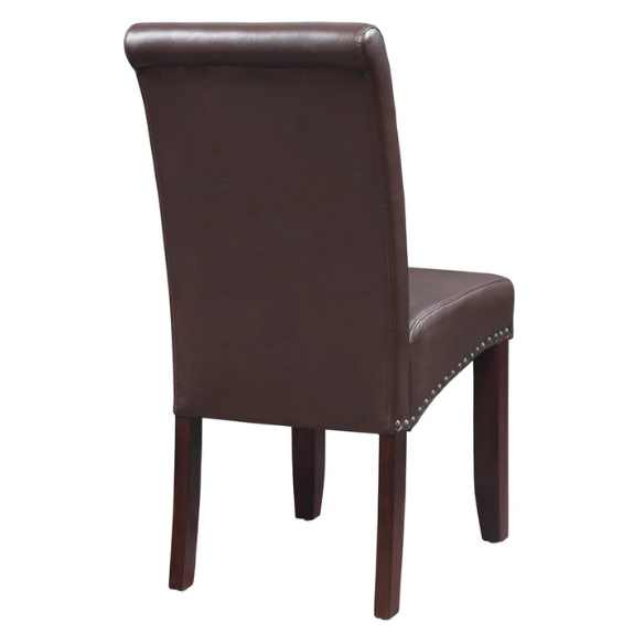 Brown faux leather Parsons chair with scrolled back, antique bronze nailhead trim, and solid wood legs