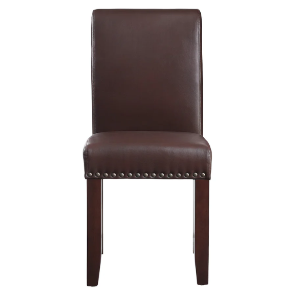 Brown faux leather Parsons chair with scrolled back, antique bronze nailhead trim, and solid wood legs