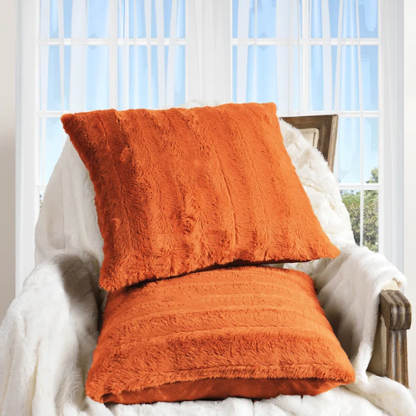 Set of two burnt orange faux fur throw pillows, 18x18 inches, square plush decorative cushions with microfiber fill—perfect for adding warmth and color to sofas, beds, and cozy spaces