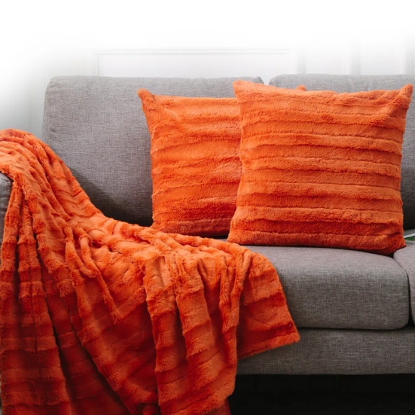 Set of two burnt orange faux fur throw pillows, 18x18 inches, square plush decorative cushions with microfiber fill—perfect for adding warmth and color to sofas, beds, and cozy spaces