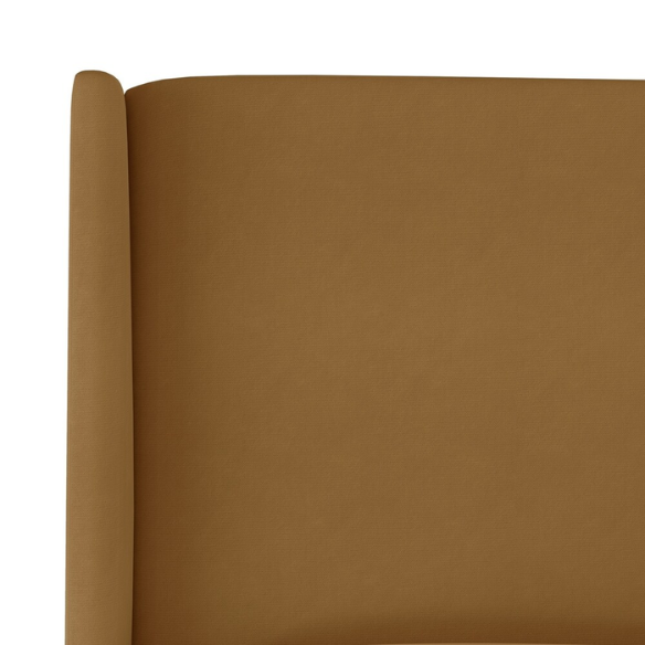 Camel king-size upholstered bed in velvet fabric with wingback headboard and low-profile black metal legs.