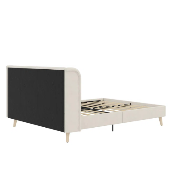 Light cream velvet upholstered queen platform bed with wingback tufted headboard and mid-century angled wood legs.