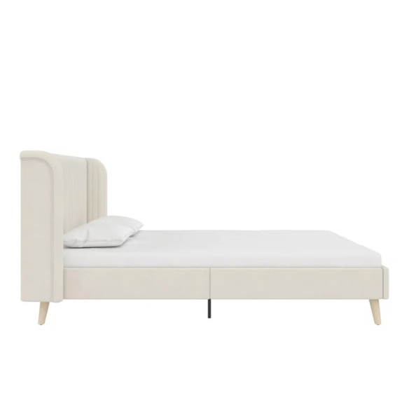 Light cream velvet upholstered queen platform bed with wingback tufted headboard and mid-century angled wood legs.