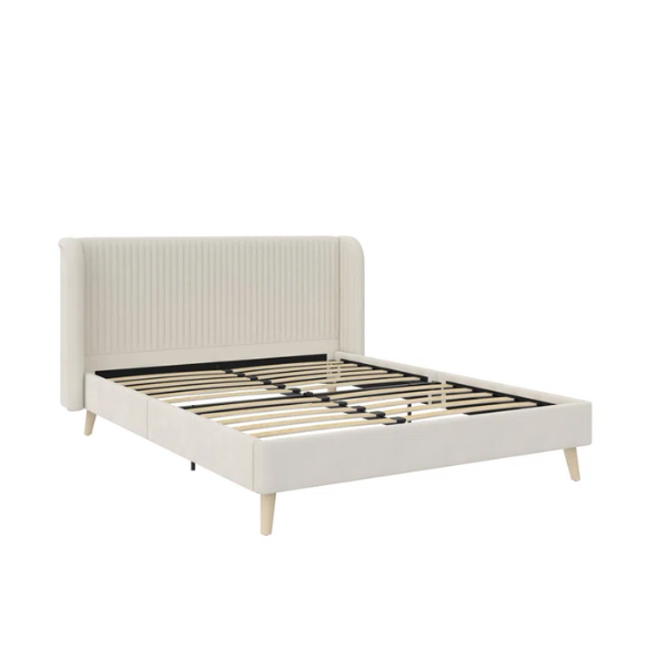 Light cream velvet upholstered queen platform bed with wingback tufted headboard and mid-century angled wood legs.