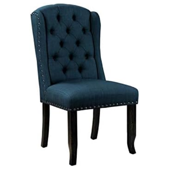 Set of two dark blue upholstered farmhouse dining chairs with tufted backs, brass nailhead trim, and antique black wood legs.