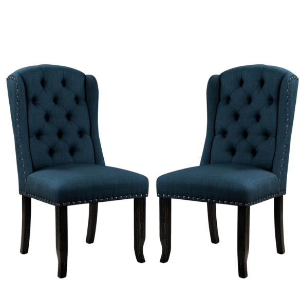 Set of two dark blue upholstered farmhouse dining chairs with tufted backs, brass nailhead trim, and antique black wood legs.