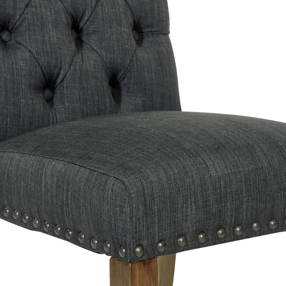 Set of 2 dark grey button-tufted farmhouse dining chairs with rustic wood legs, nailhead trim, and upholstered linen-like fabric.