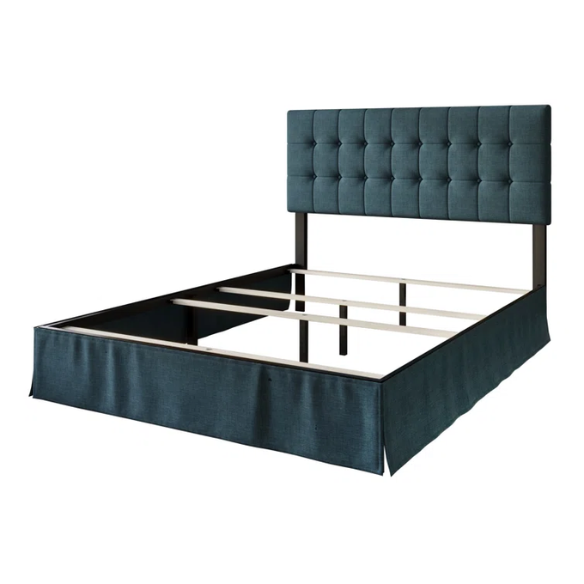Denim blue upholstered queen bed with tufted wingback headboard and nailhead trim on wood and metal frame.