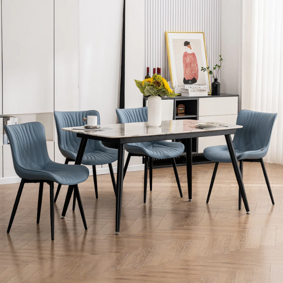 Set of 2 dusty blue faux leather dining chairs with fishtail tufted back and black metal legs, perfect for modern dining rooms or kitchen spaces.