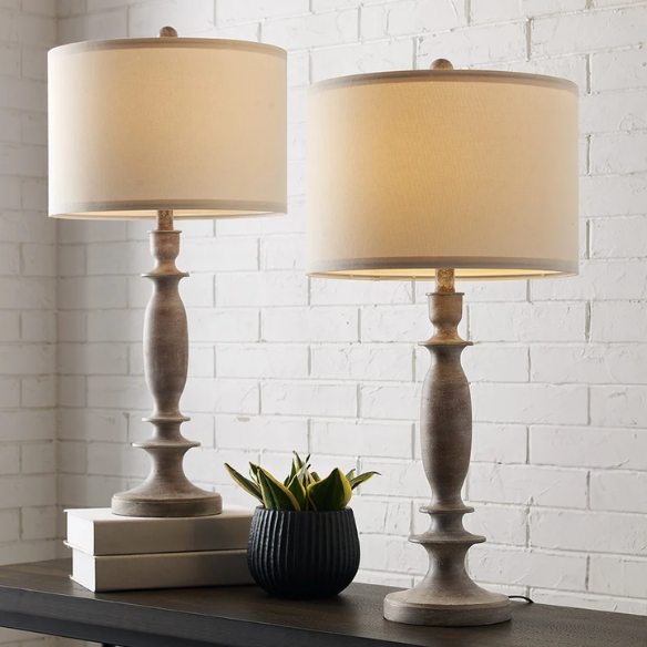 Set of 2 farmhouse-style 29-inch table lamps with hand-painted wood finish, white linen drum shades, and energy-efficient LED bulbs