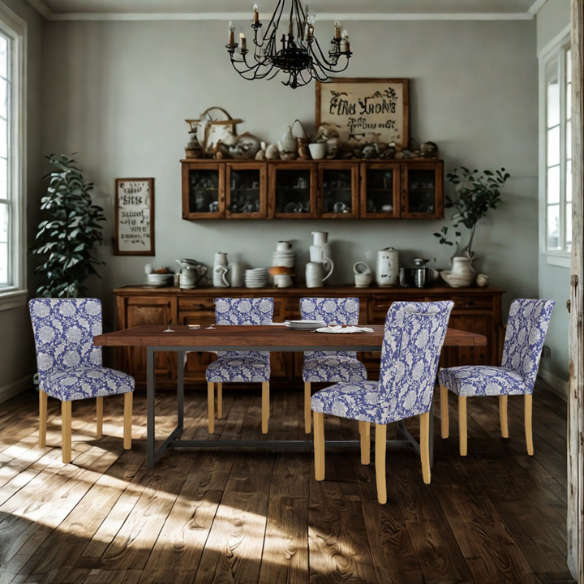 Set of two blue and cream floral Parsons dining chairs with high back, scalloped seat front, and wood legs in a traditional design