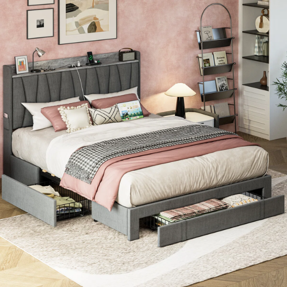 Full size dark grey upholstered platform bed with padded linen headboard, built-in storage shelf and charging station, and three underbed rolling drawers for extra storage.