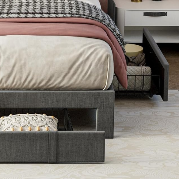Full size dark grey upholstered platform bed with padded linen headboard, built-in storage shelf and charging station, and three underbed rolling drawers for extra storage.