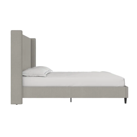 Grey canvas queen platform bed with extra-tall wingback tufted headboard and black tapered legs.