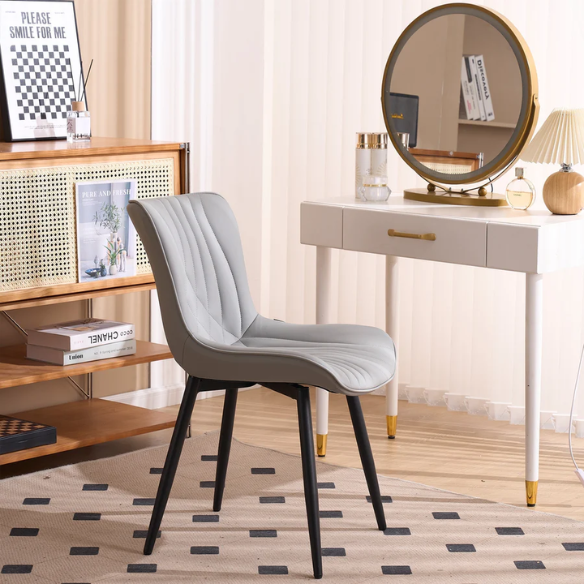 Set of 2 grey faux leather dining chairs with fishtail tufted backs and black metal legs, ideal for modern and minimalist dining room interiors.