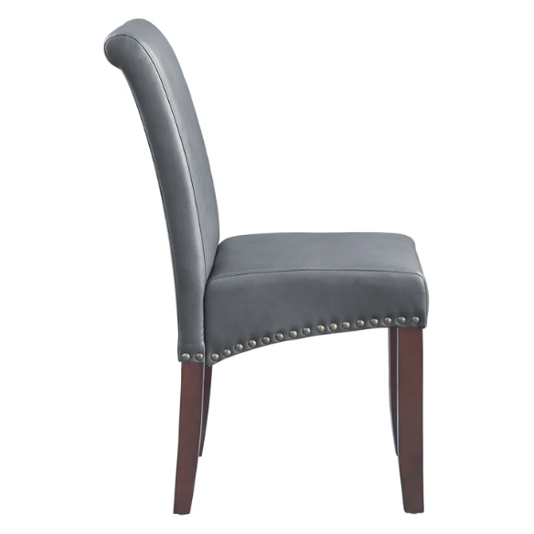 Grey leather Parsons chair with high back, scrolled shoulders, antique bronze nailhead trim, and solid wood legs