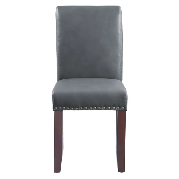 Grey leather Parsons chair with high back, scrolled shoulders, antique bronze nailhead trim, and solid wood legs