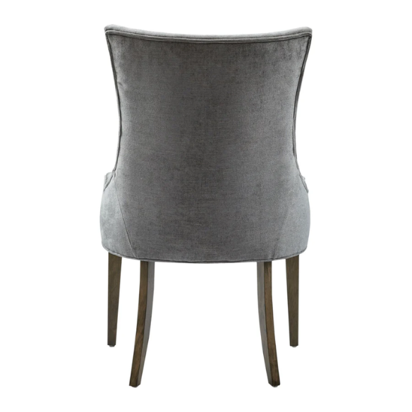 Set of 2 upholstered armless dining chairs in soft grey chenille with high backs, piped detailing, and solid wood legs.