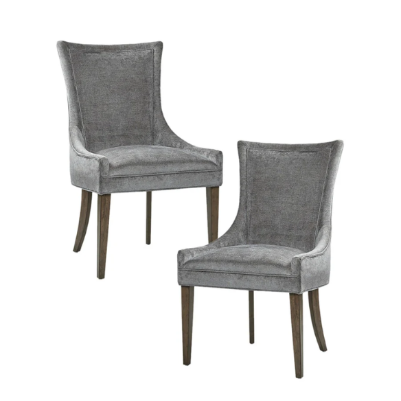 Set of 2 upholstered armless dining chairs in soft grey chenille with high backs, piped detailing, and solid wood legs.