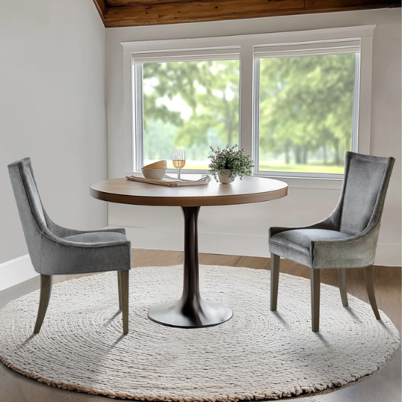 Set of 2 upholstered armless dining chairs in soft grey chenille with high backs, piped detailing, and solid wood legs.
