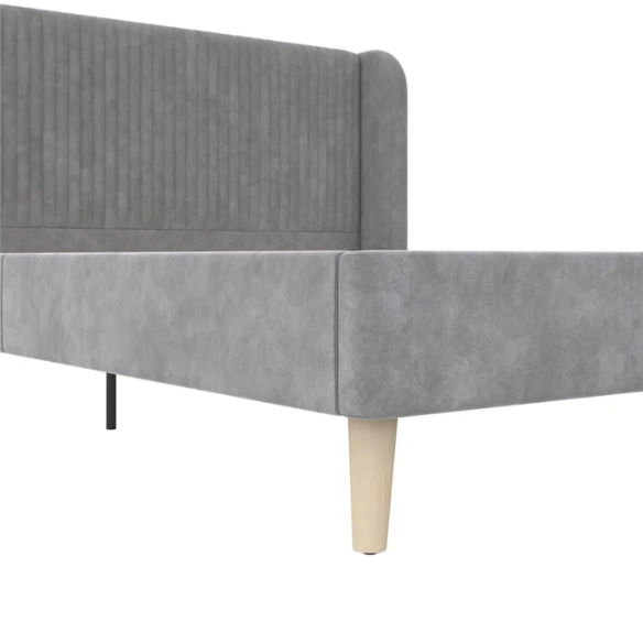 Grey velvet upholstered queen-size platform bed with wingback tufted headboard and mid-century wooden legs.