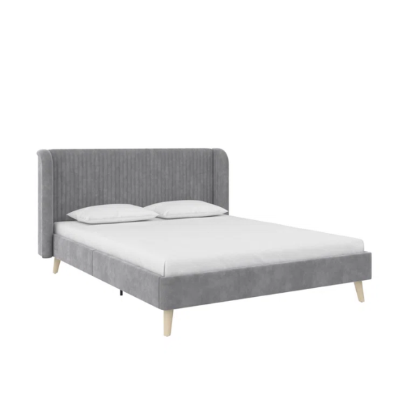 Grey velvet upholstered queen-size platform bed with wingback tufted headboard and mid-century wooden legs.