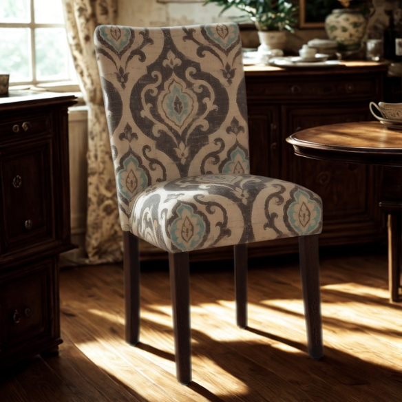 Set of two Parsons dining chairs with grey, white, and light blue floral upholstery, high back design, scalloped seat front, and wood legs