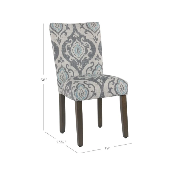 Set of two Parsons dining chairs with grey, white, and light blue floral upholstery, high back design, scalloped seat front, and wood legs