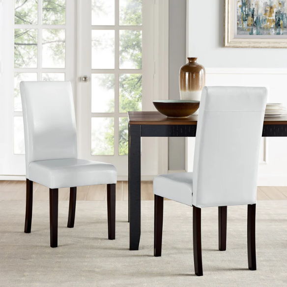 Set of 2 light grey PU leather Parsons dining chairs with cushioned seats and solid wood legs, designed for modern or contemporary dining spaces.