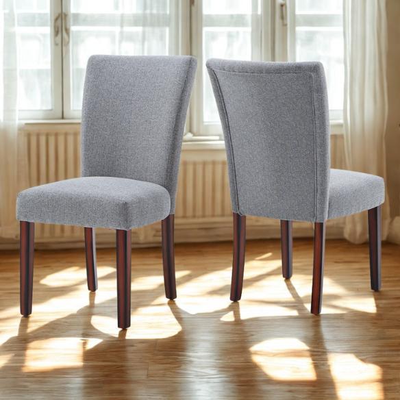 Set of 2 upholstered Parson dining chairs in light grey fabric with espresso-finished wood legs and padded high backs, ideal for dining or accent seating.