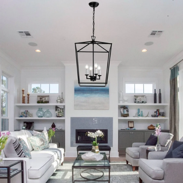 Matte black iron cage chandelier with candle-style lighting, ideal for dining rooms, foyers, and staircases